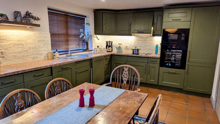 Maple Cottage bathroom with over-shower bath and luxurious toiletries